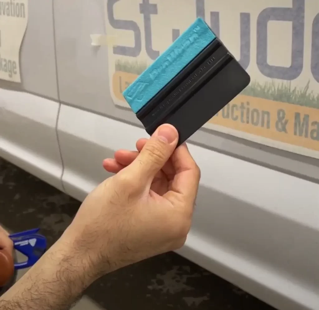 Vinyl Wrap Toronto Employee Holding a Squeegee