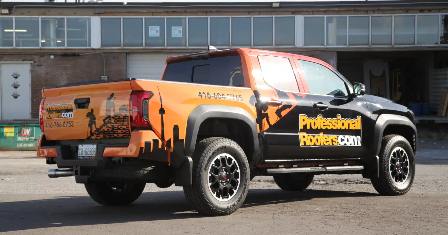 Truck featuring a branded partial wrap for ProfessionalRoofers.com, highlighting ways to Boost Brand Awareness with Truck Decals.