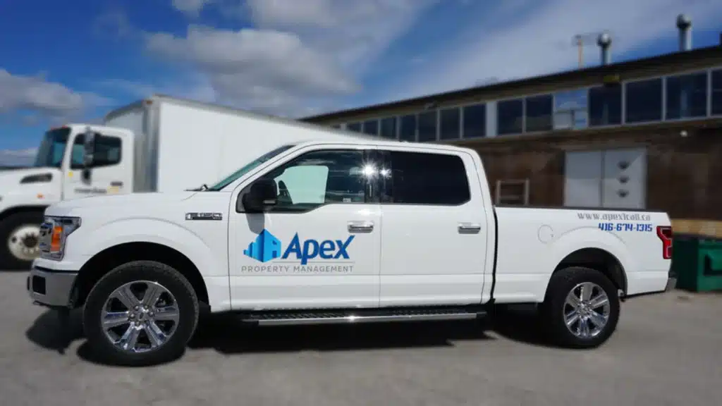 White truck with blue decal highlighting Truck Decal Design Trends.