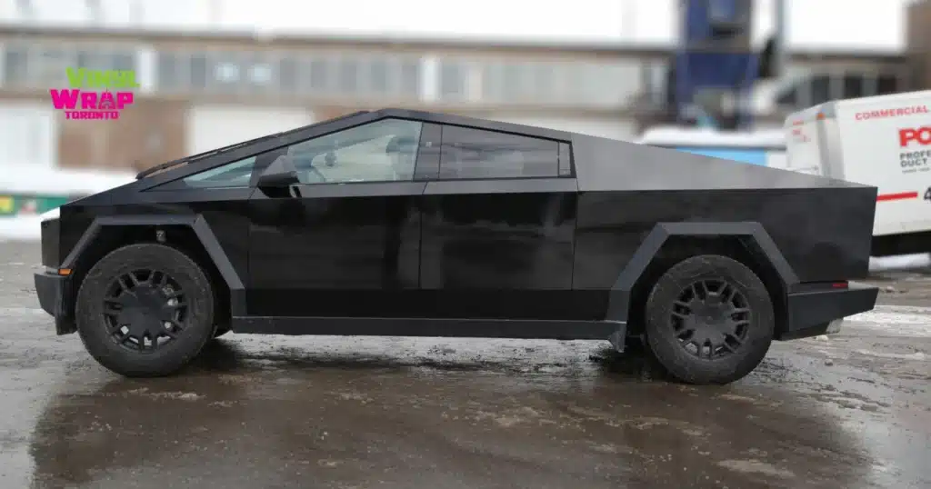 Tesla Cybertruck Wrap Toronto: Gloss Black Done Right for Diamond Property Services 1 Side profile of Tesla Cybertruck with gloss black vinyl wrap installed in Etobicoke Toronto